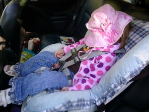 Falling asleep on the way home from the beach. Gotta love the hat